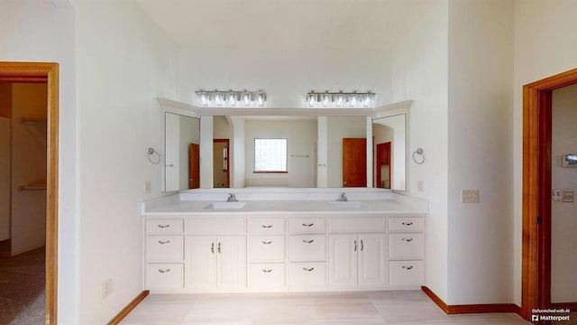 bathroom featuring tile patterned flooring and vanity