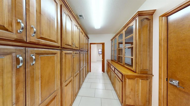 interior space with light tile patterned floors