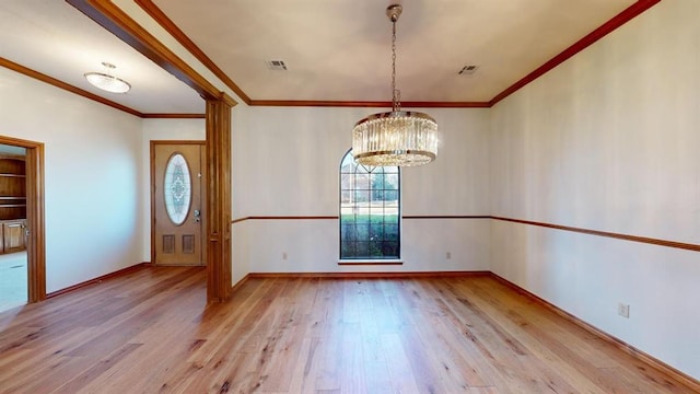 interior space featuring ornamental molding, light hardwood / wood-style flooring, and an inviting chandelier