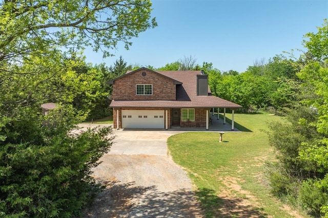 view of front of property with a front lawn and a garage