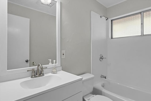 full bathroom featuring vanity, toilet, ornamental molding, and bathing tub / shower combination