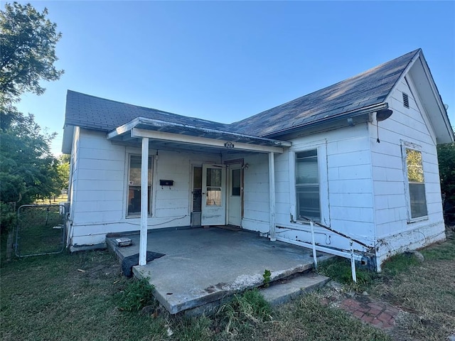 rear view of property featuring a patio area