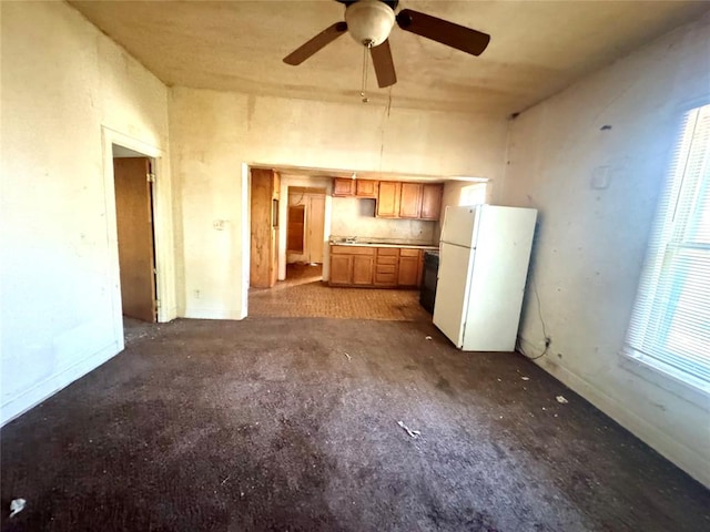 kitchen featuring ceiling fan and white fridge