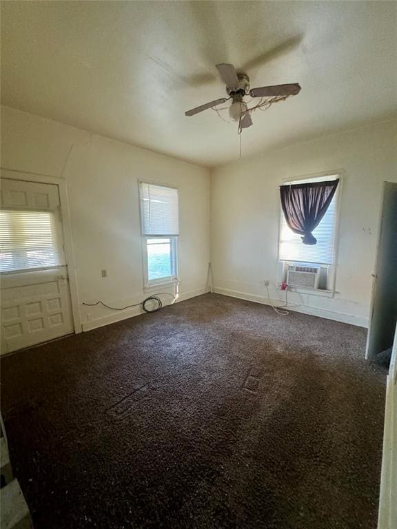 spare room with plenty of natural light, cooling unit, carpet floors, and ceiling fan