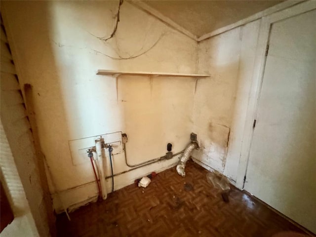 laundry area featuring washer hookup and parquet flooring