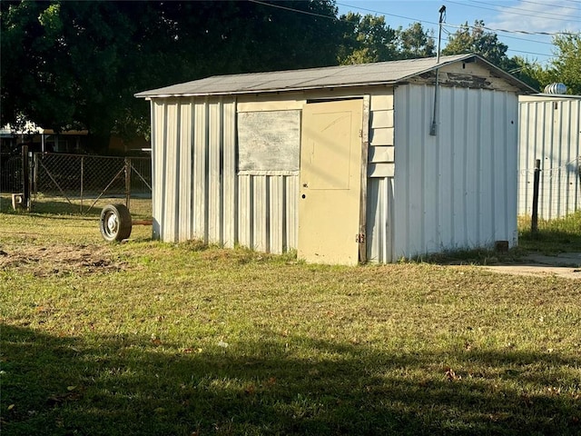 view of outdoor structure with a yard