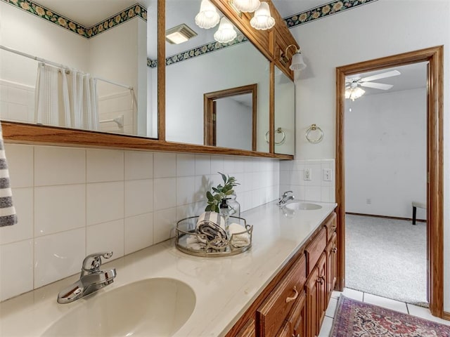 bathroom with double vanity, decorative backsplash, visible vents, and a sink