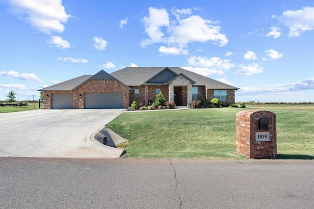 craftsman-style home featuring a front lawn and a garage