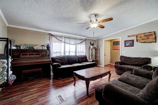 living room featuring visible vents, wood finished floors, lofted ceiling, and ornamental molding