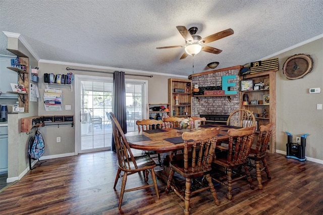 dining space featuring a ceiling fan, wood finished floors, a fireplace, and ornamental molding