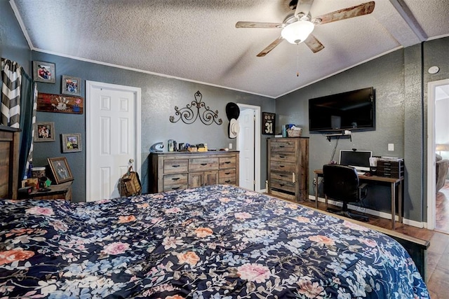 bedroom featuring lofted ceiling, a textured wall, and a textured ceiling