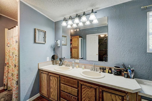 full bath featuring a textured wall and a sink