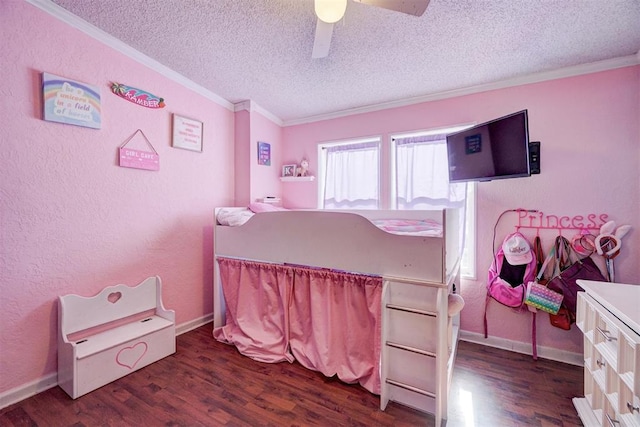 bedroom featuring wood finished floors, a textured ceiling, ornamental molding, and a textured wall