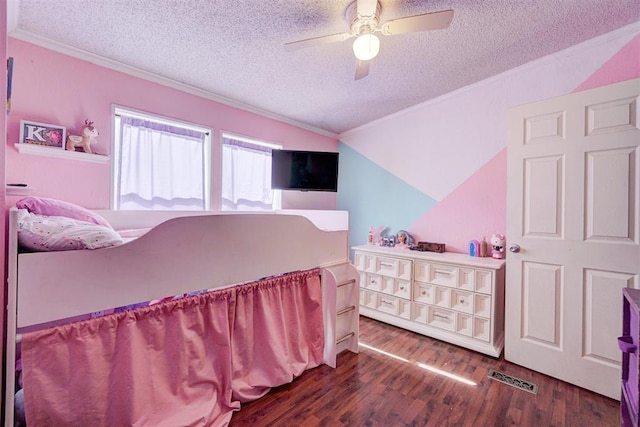 bedroom with visible vents, a textured ceiling, wood finished floors, and crown molding