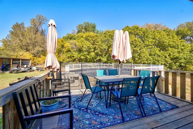 wooden terrace with outdoor dining area