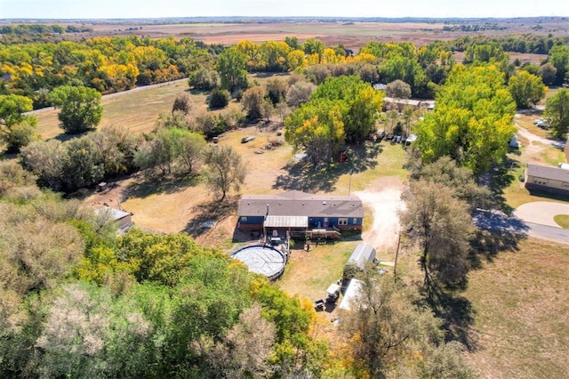 birds eye view of property with a rural view