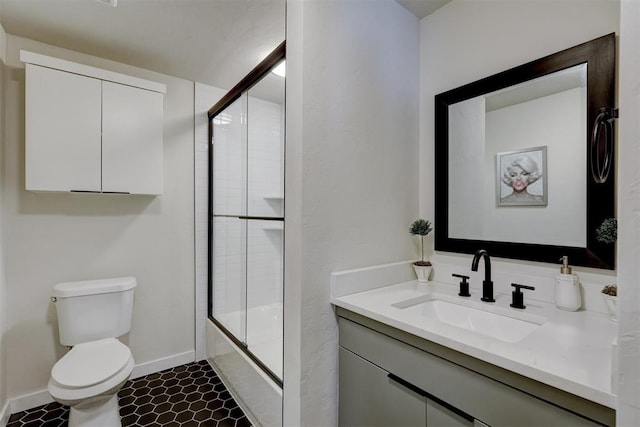 full bathroom featuring tile patterned floors, vanity, toilet, and shower / bath combination with glass door