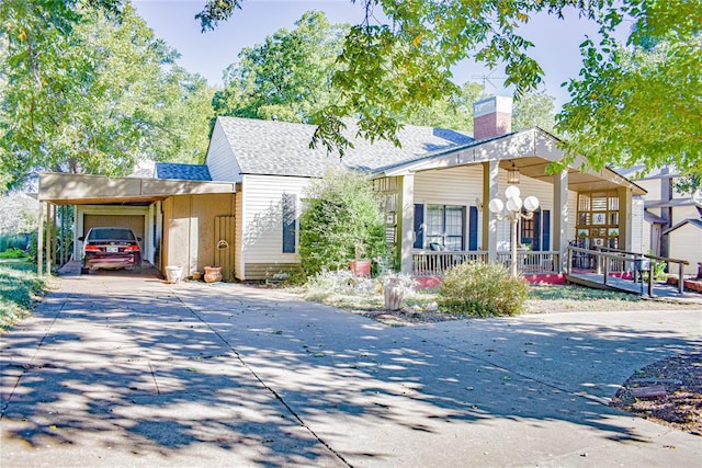 view of front of house featuring a carport and a porch