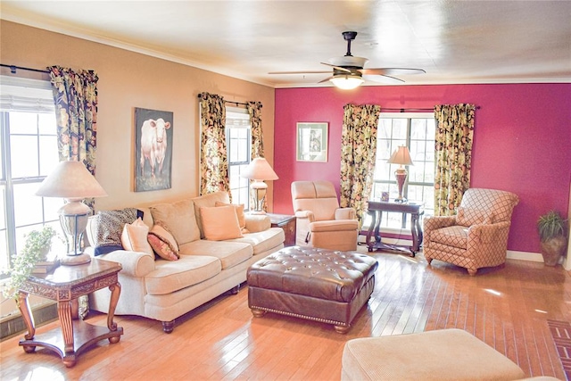 living room featuring crown molding, ceiling fan, and wood-type flooring