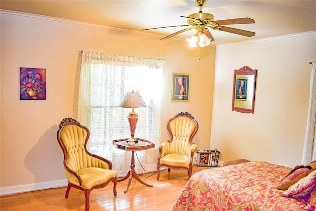 bedroom featuring wood-type flooring, ceiling fan, and ornamental molding