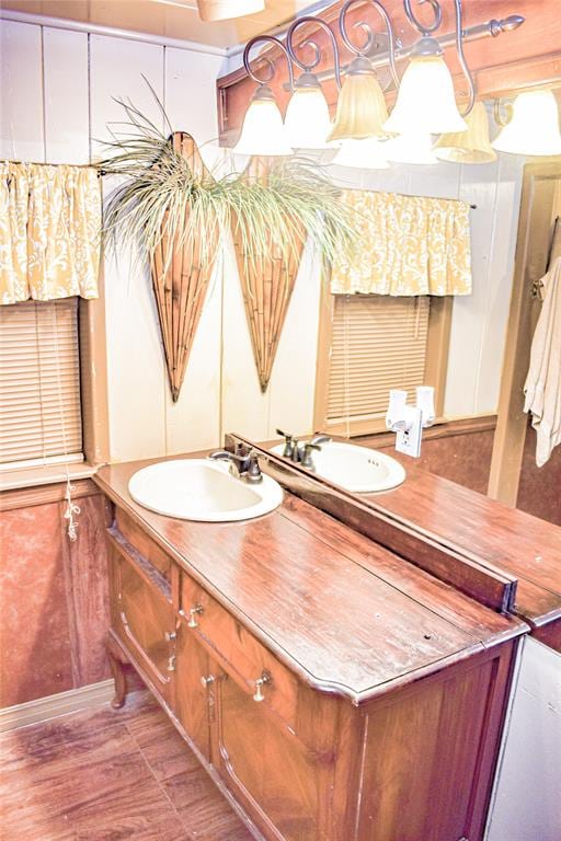 bathroom featuring vanity and hardwood / wood-style flooring