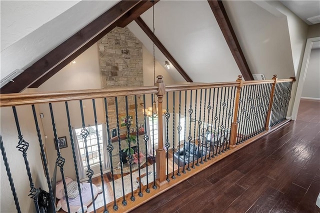 corridor featuring hardwood / wood-style floors, beamed ceiling, and high vaulted ceiling