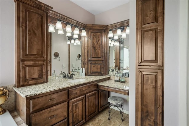 bathroom featuring tile patterned flooring and vanity