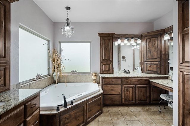 bathroom with tile patterned flooring, vanity, a relaxing tiled tub, and a notable chandelier