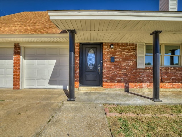 view of exterior entry featuring a garage