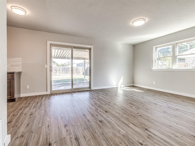 unfurnished living room featuring light hardwood / wood-style flooring