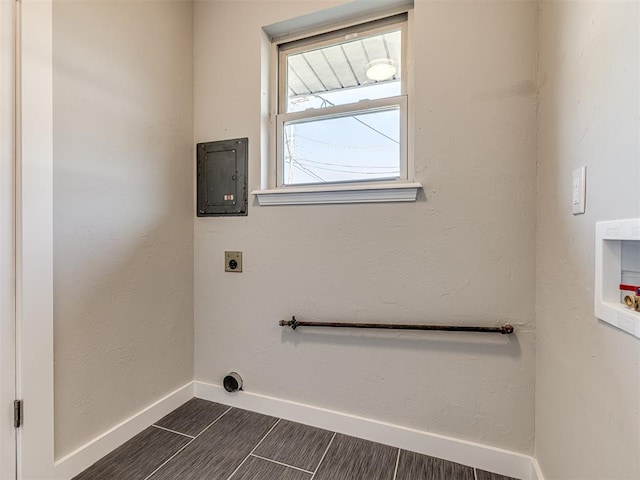 laundry area featuring electric dryer hookup, electric panel, dark wood-type flooring, and hookup for a washing machine