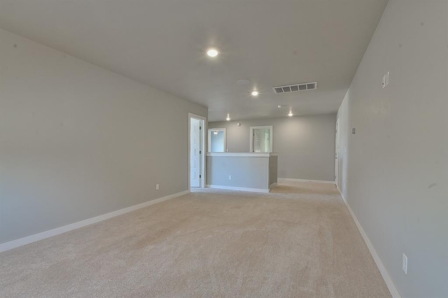 empty room featuring light carpet