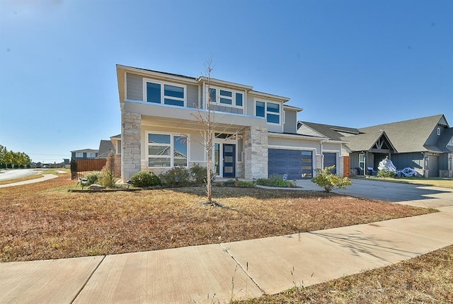 view of front facade with a garage and a front lawn