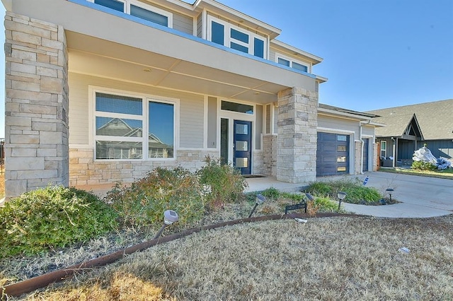 doorway to property featuring a garage