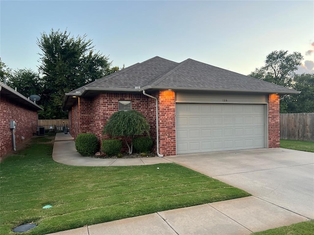 view of front of house featuring a garage and a front yard