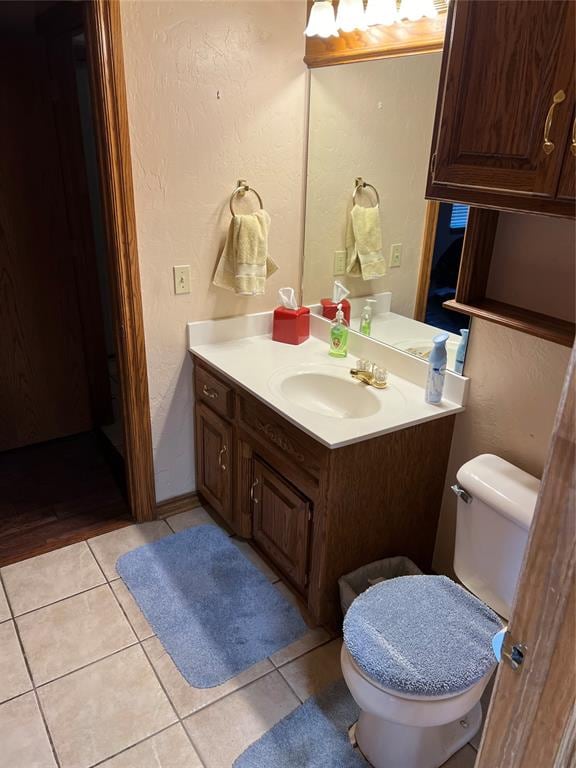 bathroom with tile patterned floors, vanity, and toilet