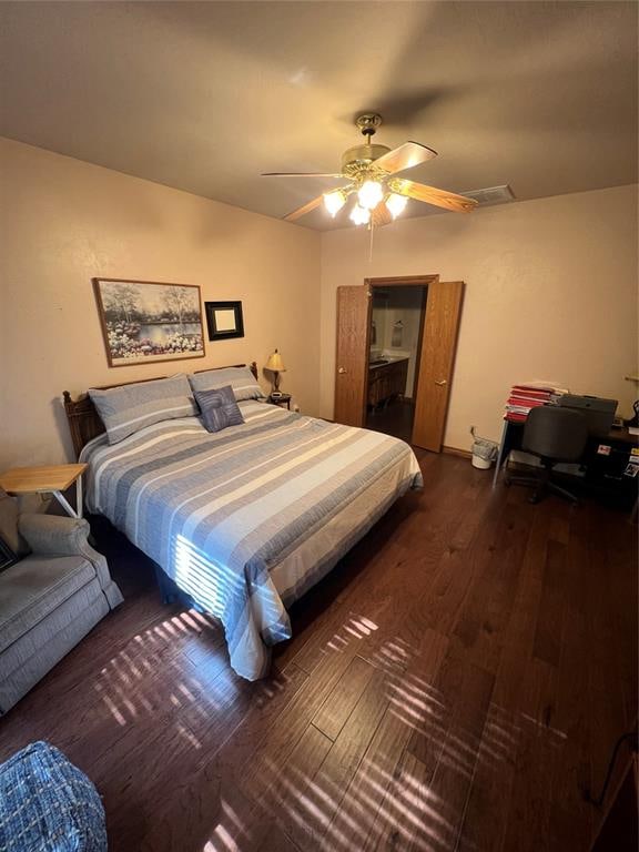 bedroom with ceiling fan and dark wood-type flooring