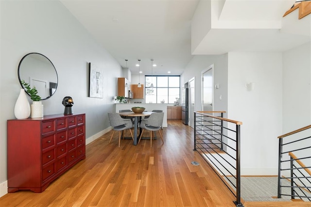 dining room with light hardwood / wood-style floors