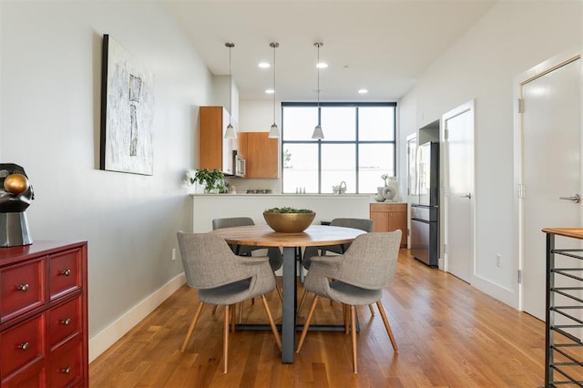 dining room with light hardwood / wood-style floors