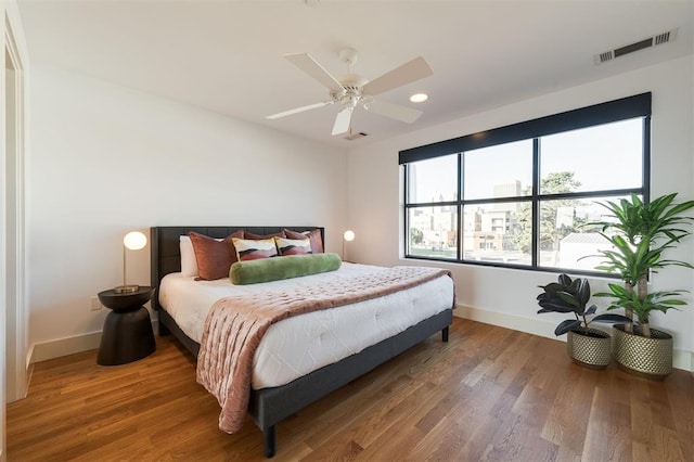 bedroom featuring ceiling fan and wood-type flooring