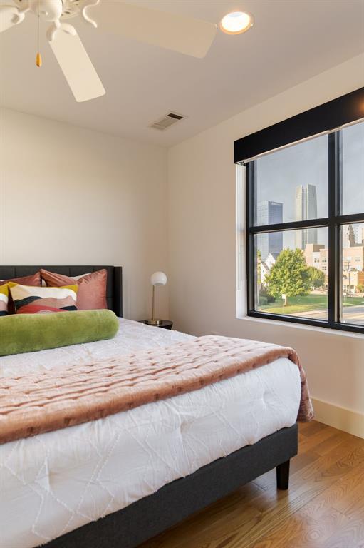 bedroom featuring hardwood / wood-style floors and ceiling fan