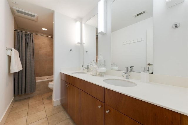 full bathroom featuring tile patterned flooring, shower / bath combination with curtain, toilet, and vanity