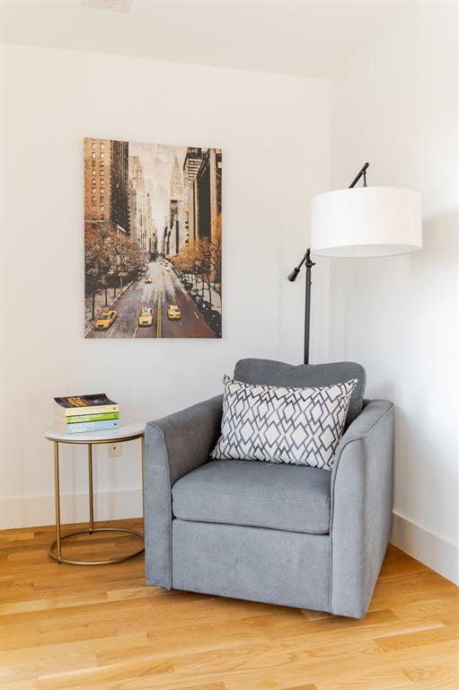 sitting room with hardwood / wood-style flooring