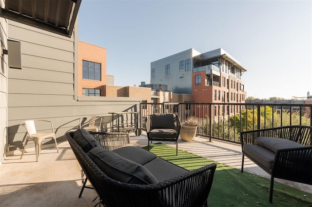 view of patio featuring a balcony