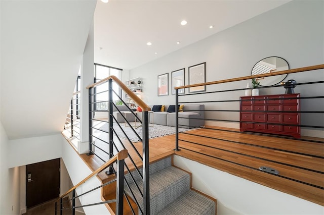 stairway featuring hardwood / wood-style floors