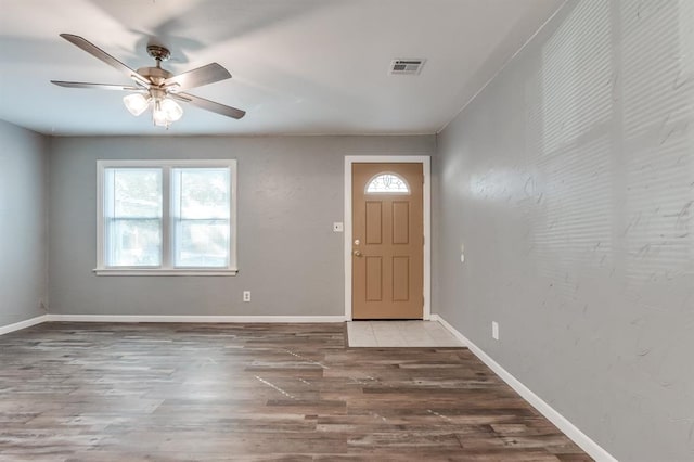 foyer entrance with hardwood / wood-style flooring and ceiling fan