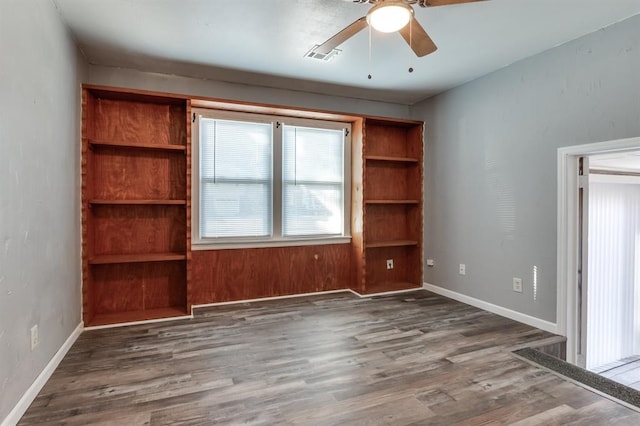 unfurnished room featuring ceiling fan and dark hardwood / wood-style floors