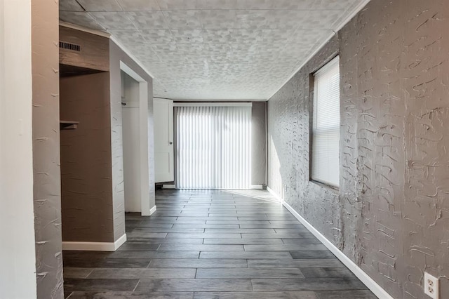 corridor featuring hardwood / wood-style flooring