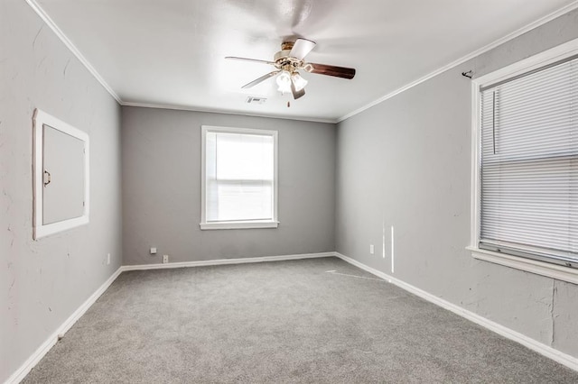 unfurnished room featuring carpet flooring, ceiling fan, and ornamental molding