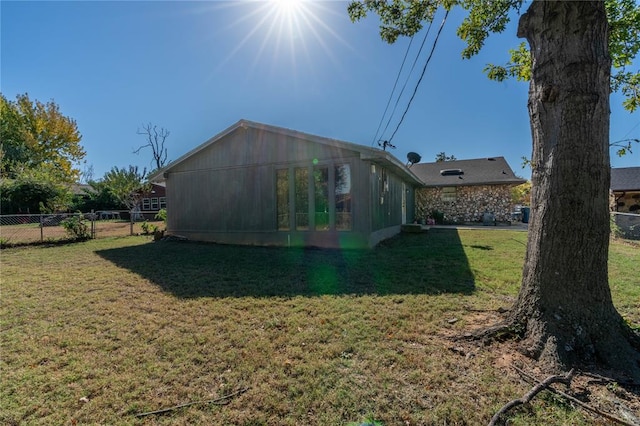 rear view of house with a lawn